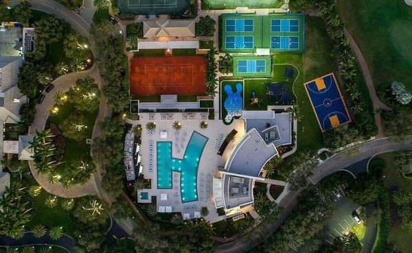 Night aerial of the Boca Grove clubhouse, pool and courts
